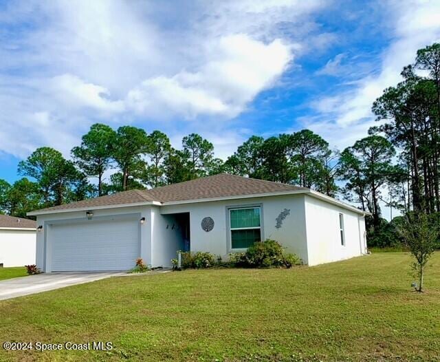 single story home with a front lawn and a garage