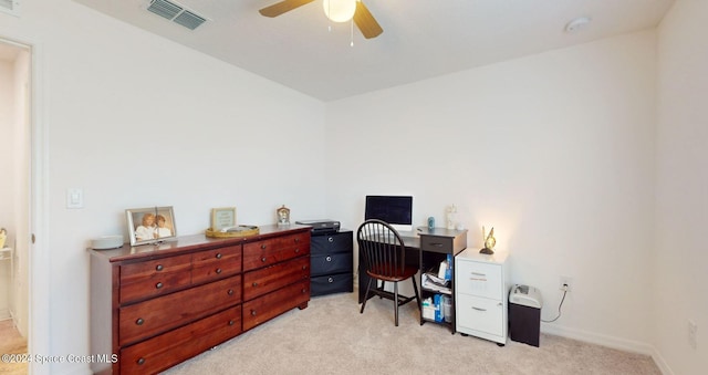 office space with light carpet and ceiling fan