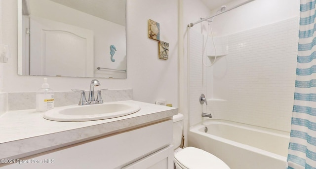 full bathroom with shower / tub combo, vanity, and toilet