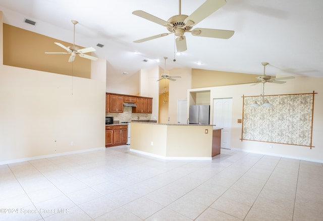 interior space with light tile patterned floors and high vaulted ceiling