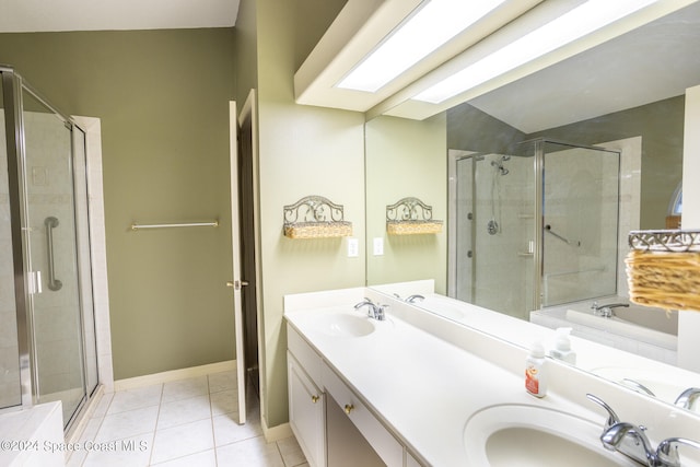 bathroom featuring tile patterned flooring, vanity, and shower with separate bathtub