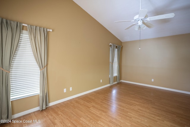 unfurnished room featuring ceiling fan, light hardwood / wood-style floors, and lofted ceiling