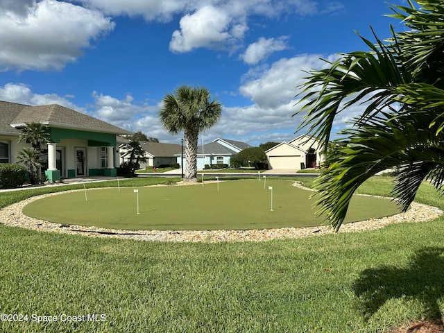 surrounding community featuring a lawn