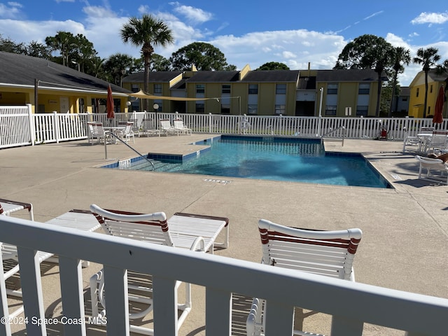 view of swimming pool with a patio area