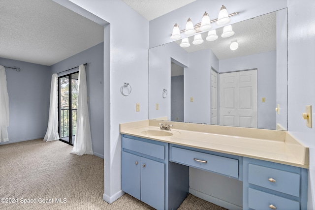 bathroom featuring vanity and a textured ceiling