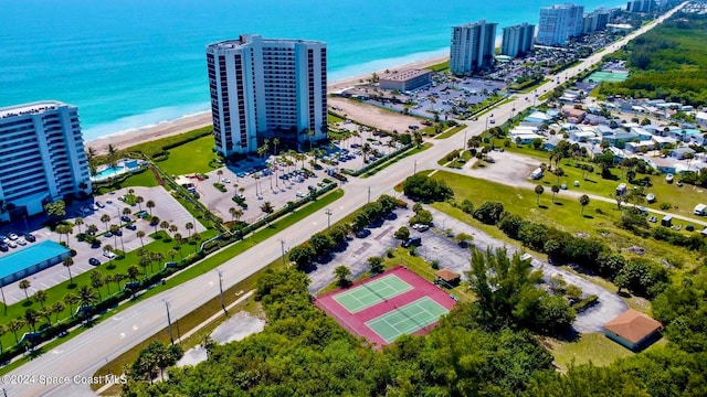 bird's eye view with a water view and a view of the beach