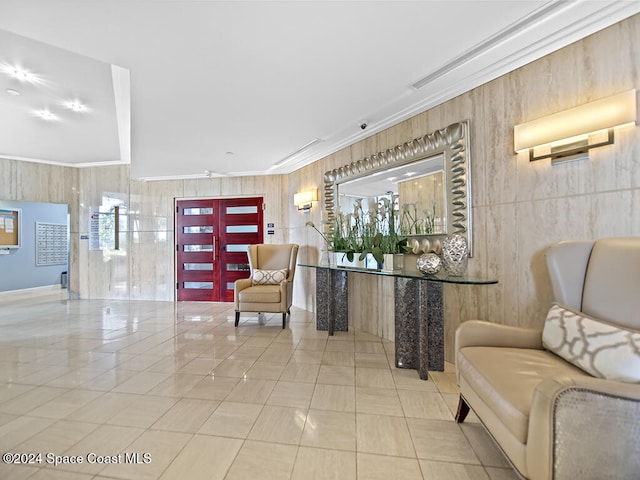 interior space with ornamental molding and light tile patterned floors