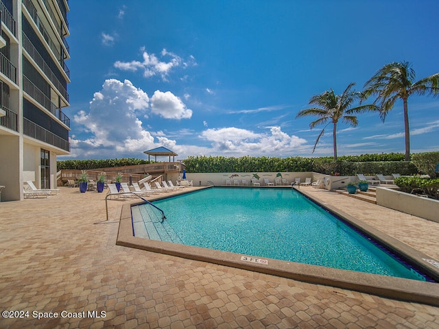 view of swimming pool with a patio