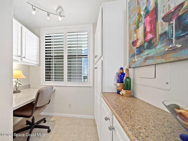 office area featuring light tile patterned flooring