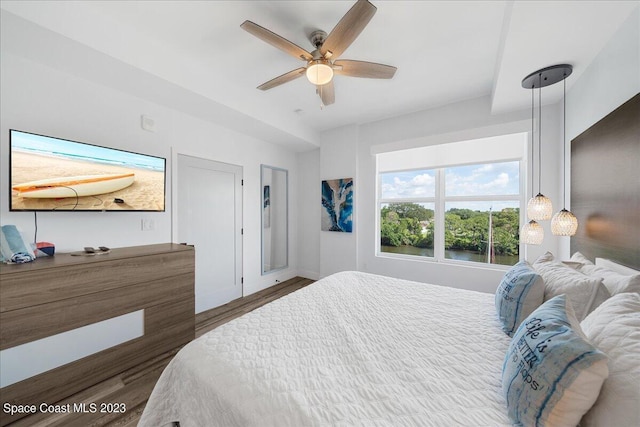 202 Ivory Coral Ln Unit 405, Merritt Island, FL 32953 - bedroom featuring wood finished floors and ceiling fan