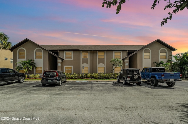 view of outdoor building at dusk