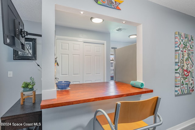 home office with a textured ceiling