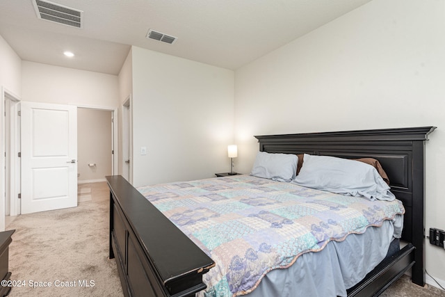 bedroom with light carpet