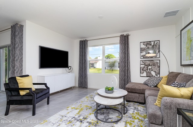 living room featuring light tile patterned flooring