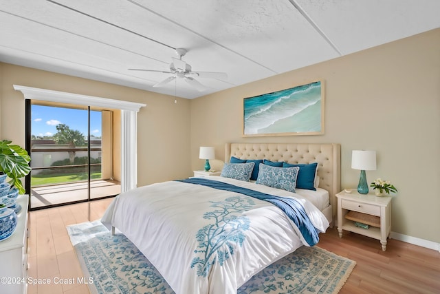 bedroom with ceiling fan, hardwood / wood-style floors, and access to exterior