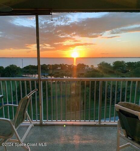 balcony at dusk with a water view