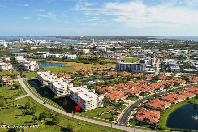 birds eye view of property with a water view