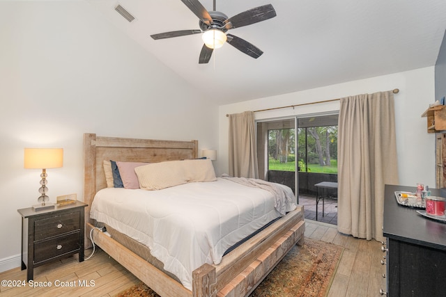 bedroom with ceiling fan, access to exterior, light hardwood / wood-style flooring, and vaulted ceiling