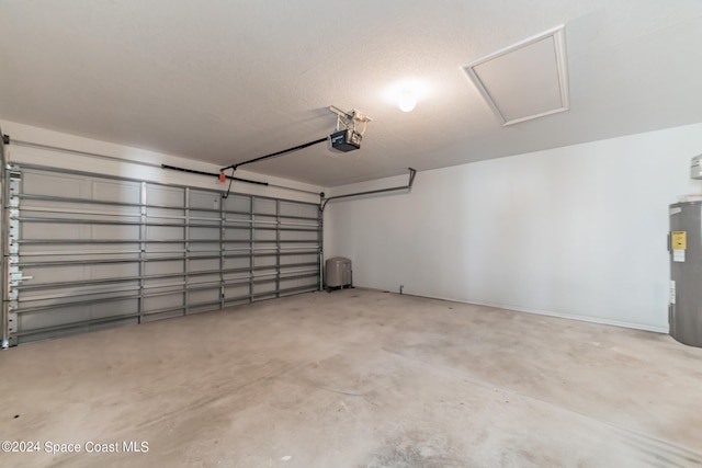 garage with a garage door opener and water heater