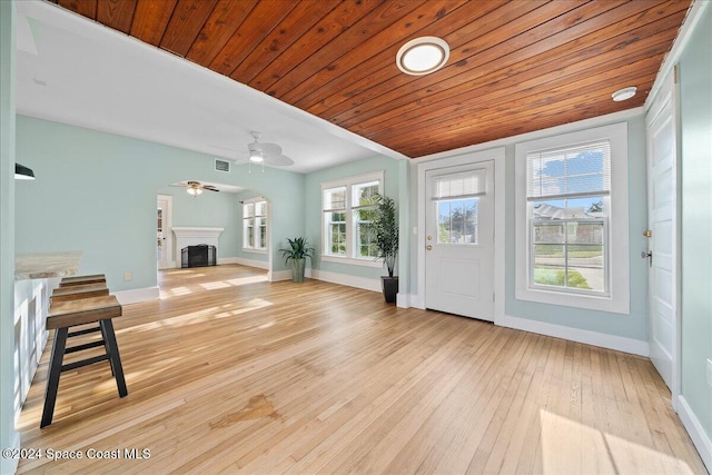 foyer with a healthy amount of sunlight, wood ceiling, light hardwood / wood-style floors, and ceiling fan