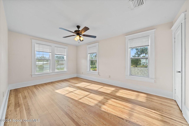 spare room with ceiling fan and light hardwood / wood-style floors