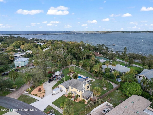 birds eye view of property with a water view