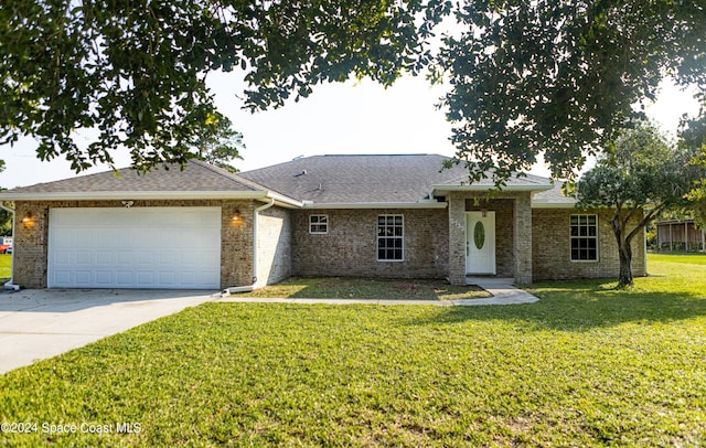 single story home with a front yard and a garage