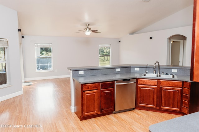 kitchen featuring lofted ceiling, sink, stainless steel dishwasher, light hardwood / wood-style floors, and ceiling fan