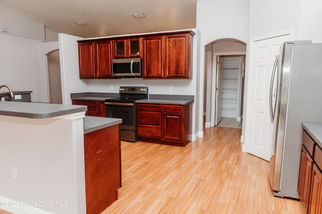 kitchen featuring light hardwood / wood-style floors and stainless steel appliances