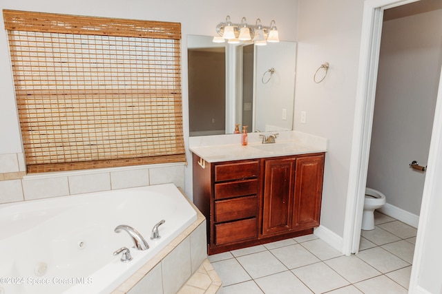 bathroom with vanity, a relaxing tiled tub, toilet, and tile patterned floors