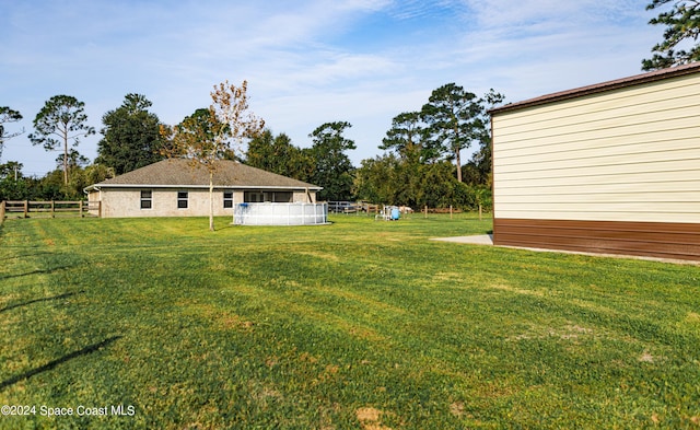 view of yard with a pool