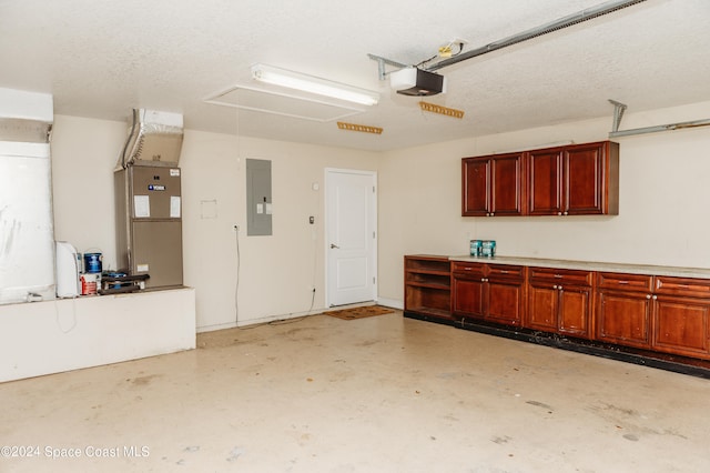 garage with heating unit, a garage door opener, and electric panel