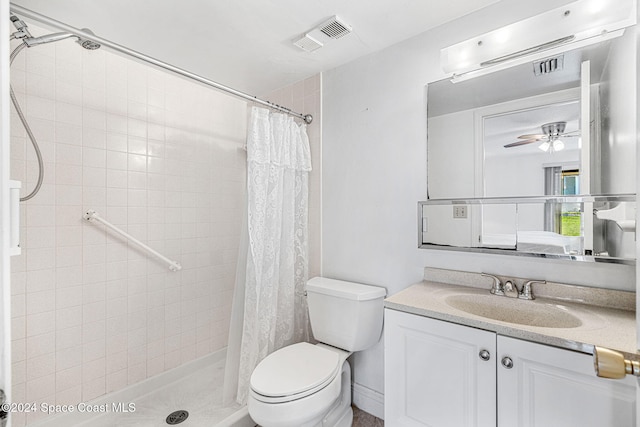 bathroom with vanity, toilet, walk in shower, and ceiling fan