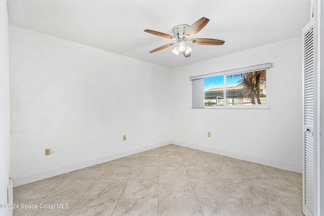 5807 N Atlantic Ave Unit 411, Cape Canaveral, FL 32920 - unfurnished bedroom with baseboards and ceiling fan