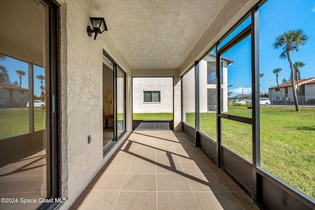 unfurnished sunroom featuring plenty of natural light