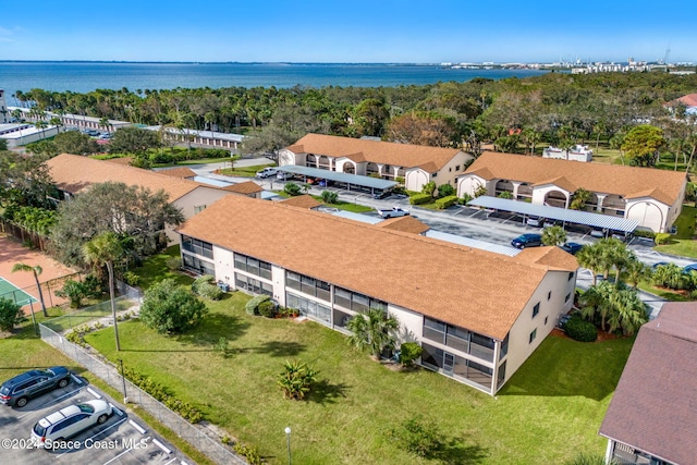 birds eye view of property with a water view