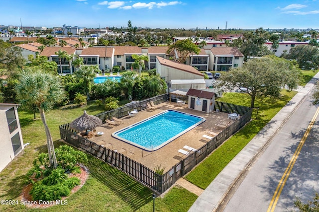 view of pool featuring an outdoor structure, a yard, and a patio