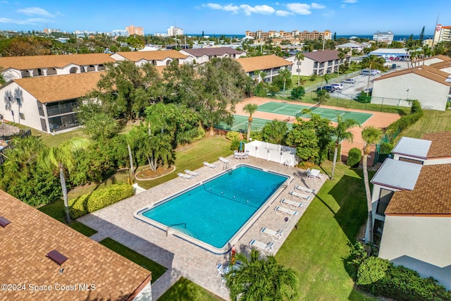 view of swimming pool with a patio area and a lawn