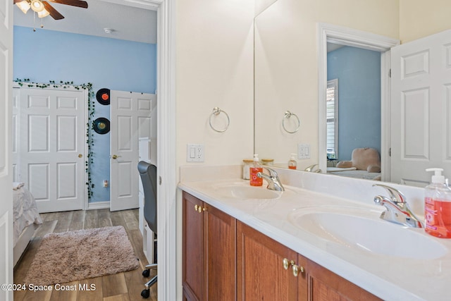 bathroom with vanity, wood-type flooring, and ceiling fan