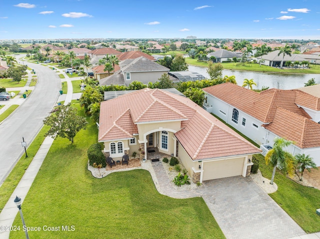 birds eye view of property featuring a water view