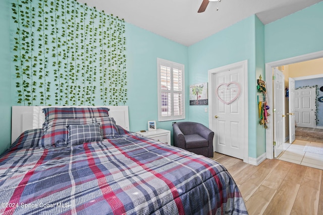 bedroom featuring light hardwood / wood-style flooring and ceiling fan