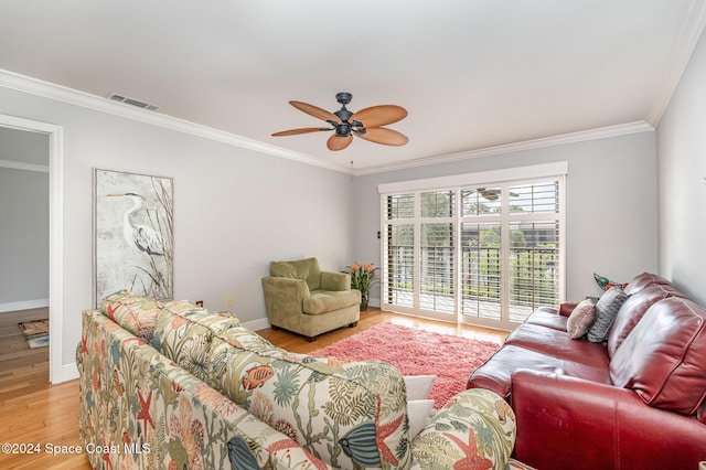 201 International Dr Unit 221, Cape Canaveral, FL 32920 - living room with crown molding, light wood-style flooring, and a ceiling fan