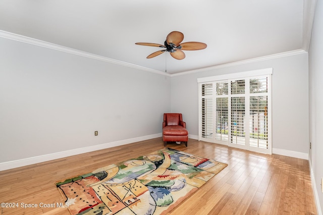 unfurnished room featuring hardwood / wood-style floors, ceiling fan, and crown molding