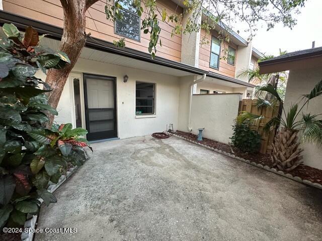 property entrance featuring a patio