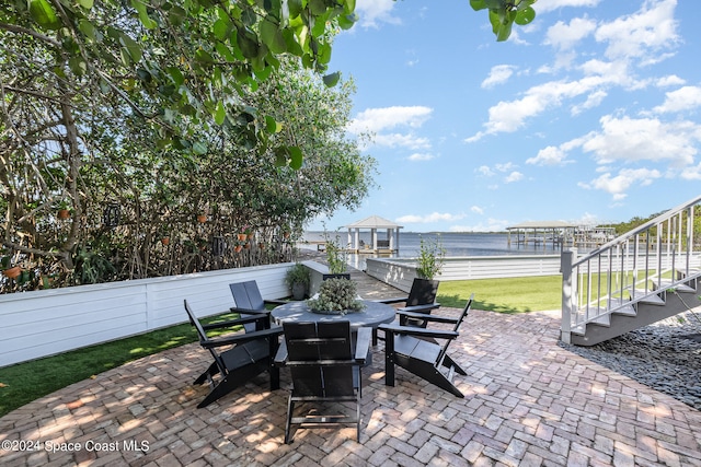 view of patio with a water view