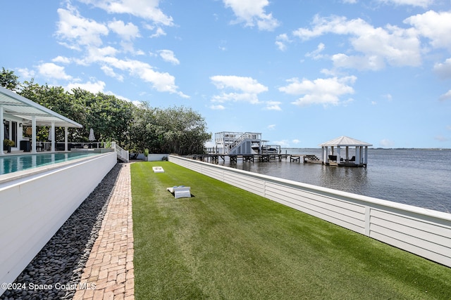 dock area featuring a yard and a water view