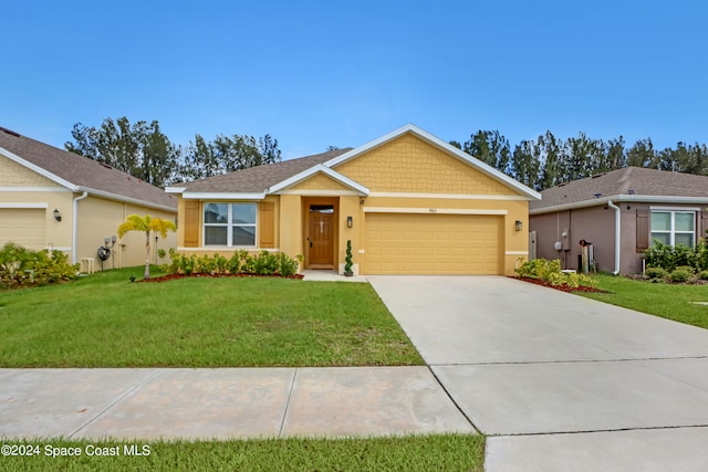 view of front facade featuring a front yard and a garage