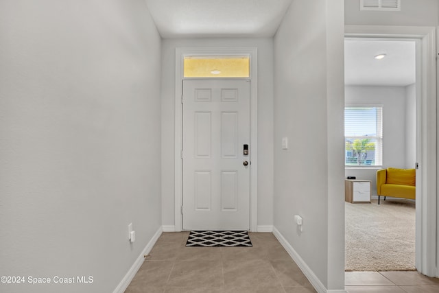 entryway featuring light tile patterned floors