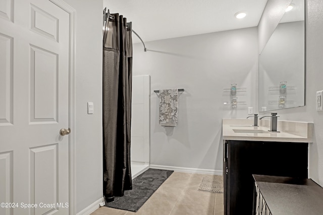 bathroom featuring vanity, tile patterned flooring, and a shower with shower curtain