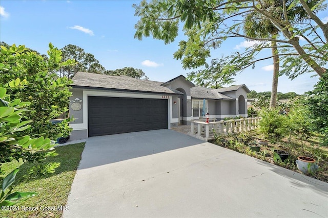 view of front of property with a garage